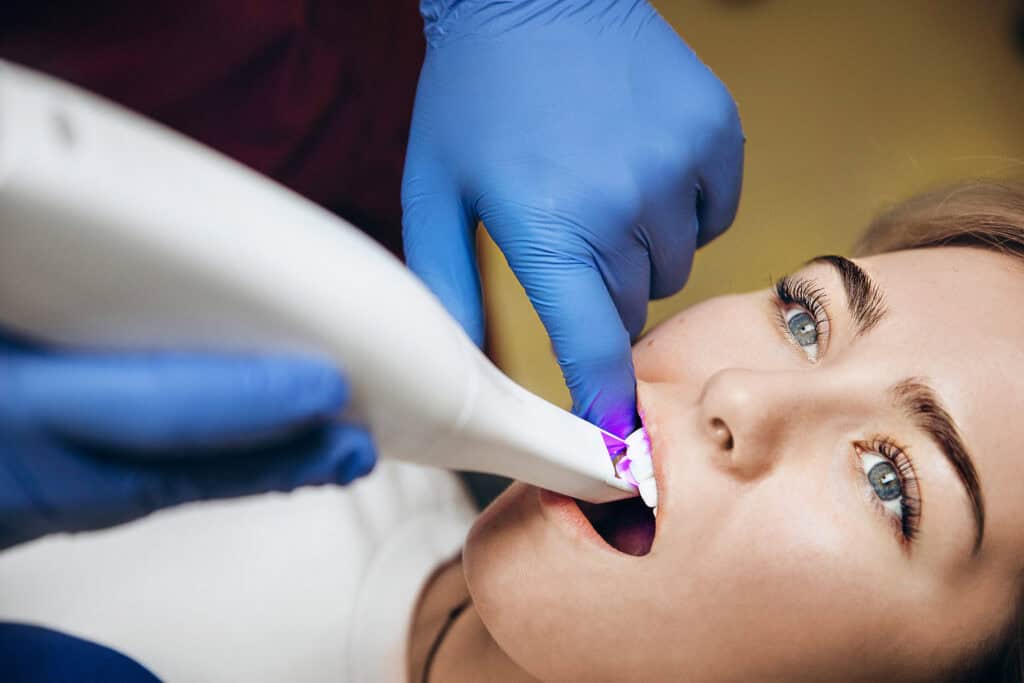 Utilizing an advanced Medit intraoral scanner for precise 3D digital dental impressions.