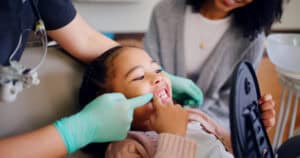 Patient receiving a welcoming checkup during their first visit to Newpark Dentistry.