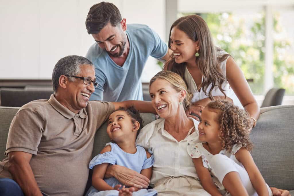 Multi-generational family smiling together, representing gentle family dental care in Park City.