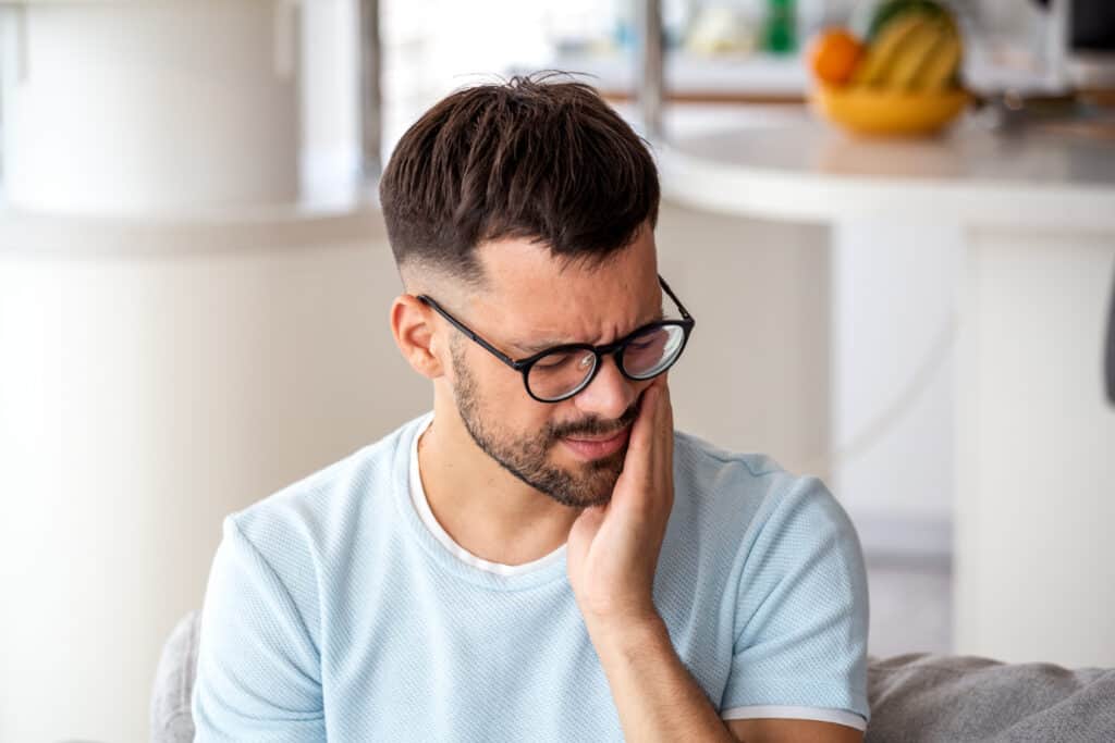 Patient receiving a supportive consultation for gentle oral surgery and tooth extractions.