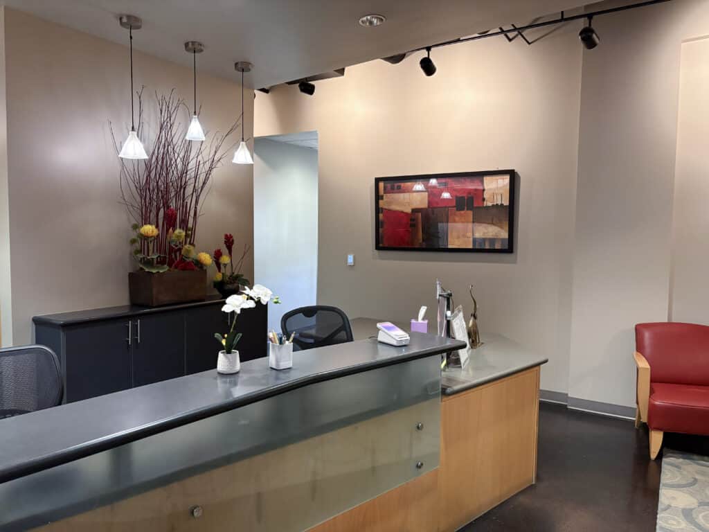 Welcoming reception desk and interior view of Newpark Dentistry in Park City, Utah.